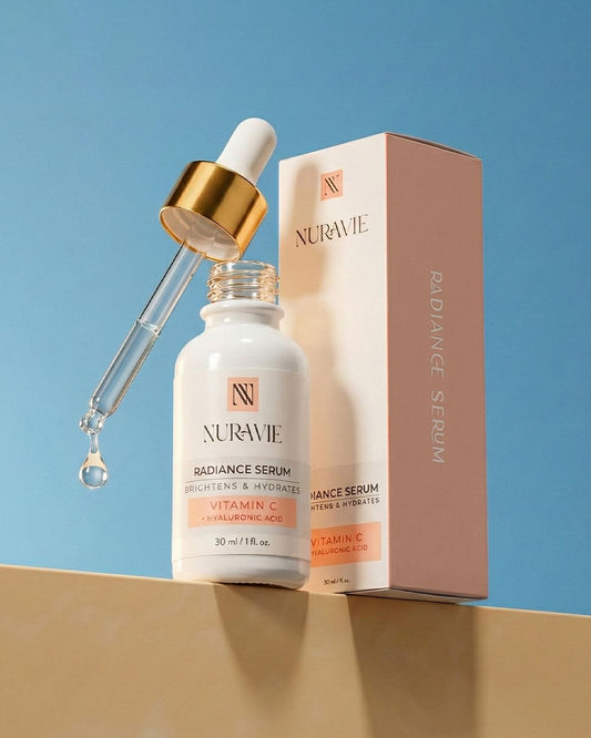 Nuravie Radiance Serum with dropper and packaging on a blue background